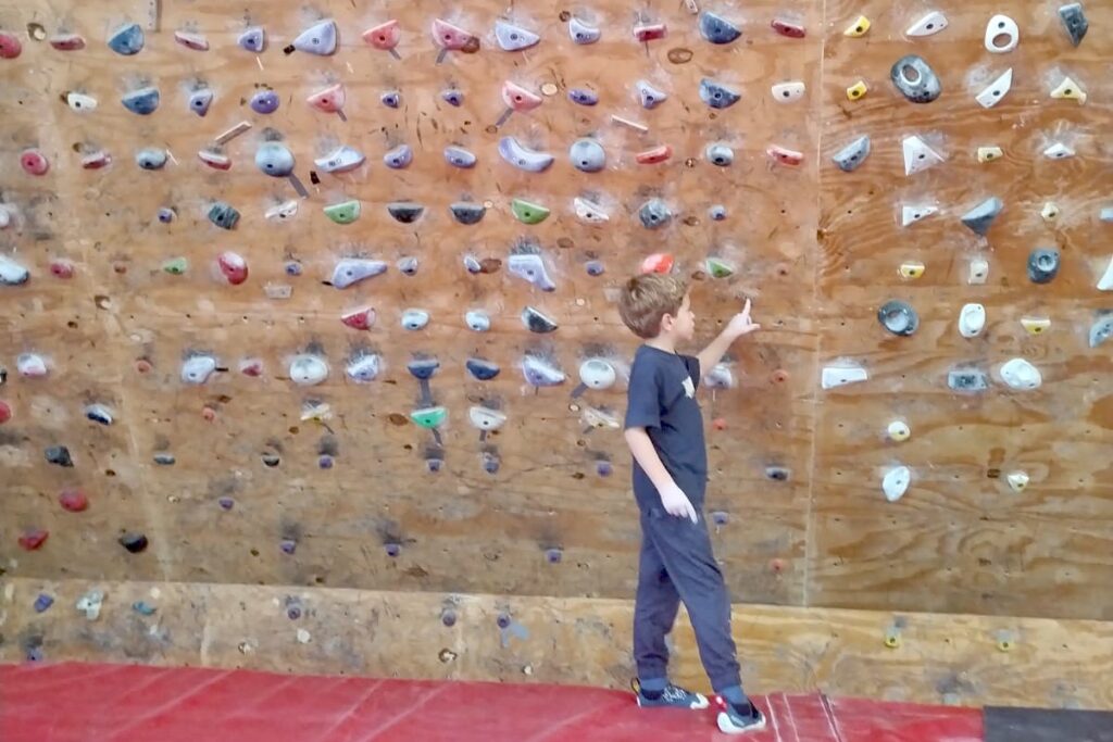 Child learning climbing