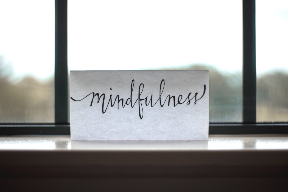 handwriten word mindfulness on windowsill